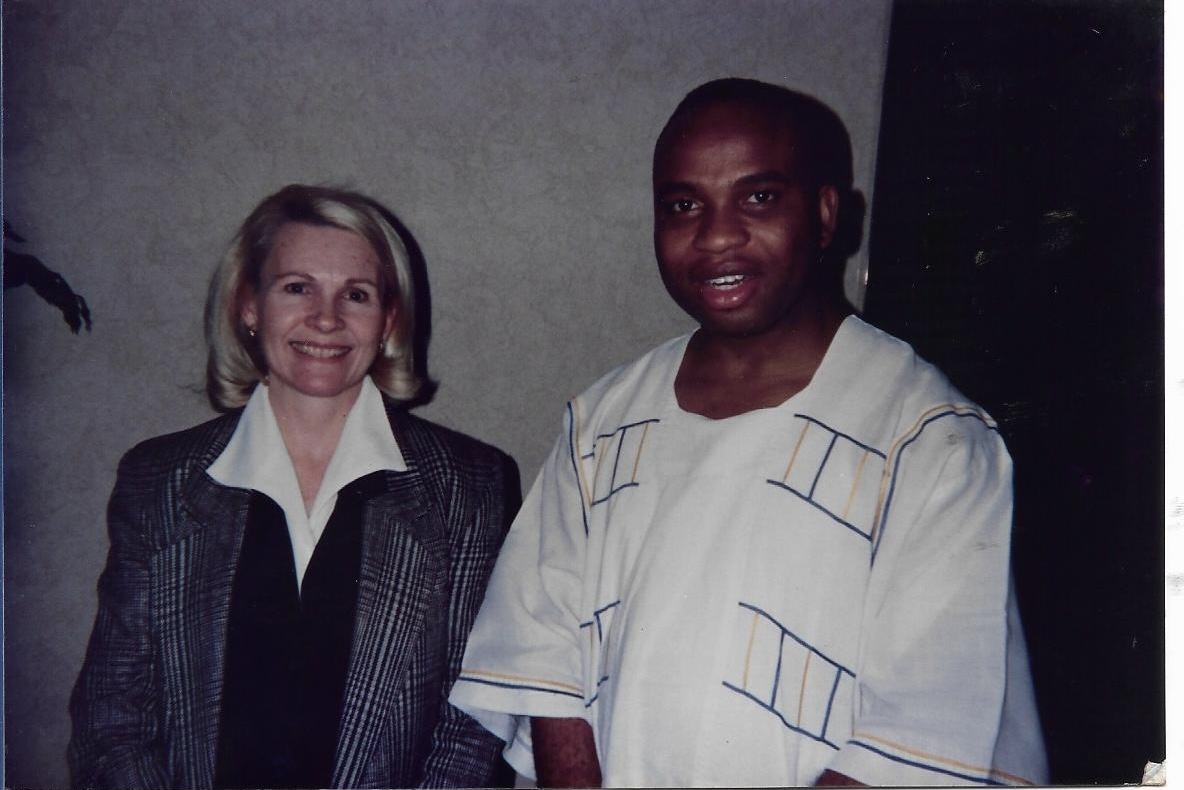 Historical photograph of two people standing together at an institutional occasion